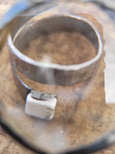 A spiral hand part of our handcrafted jewelry collection. It was hand forged from an old allan wrench