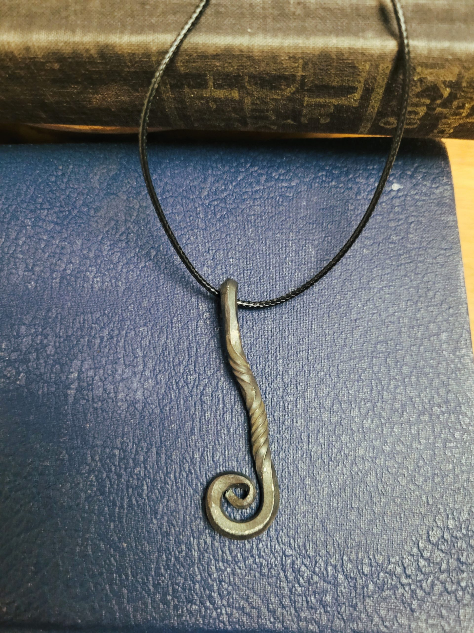A handmade piece of jewelry styles as an alchemy talisman
