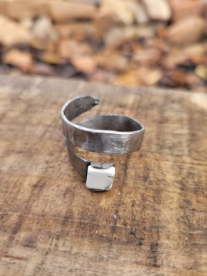 A spiral hand part of our handcrafted jewelry collection. It was hand forged from an old allan wrench